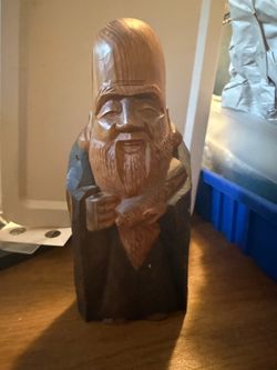 vintage Japanese hand-carved wooden statuette of Fukurokuju or Jurojin, depicting one of the Seven Lucky Gods.