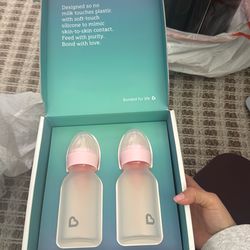 New munchkin  glass bottles