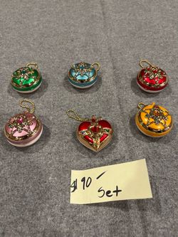 Bandai Sailor Moon gashapon set, featuring miniature transformation compacts with ball-chain keychains.