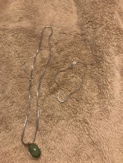 Gold and silver bracelet and silver jay