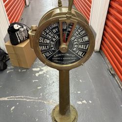 Antique brass ship engine order telegraph.
