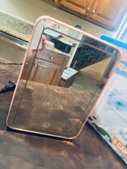 Pink mini refrigerator with mirror