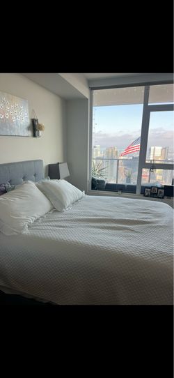 Queen bed with mattress and bed frame