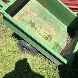 Utility dump trailer for a riding mower