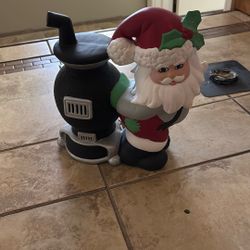 Santa Up Against Stove