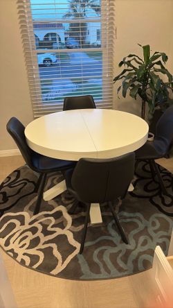 Bistro table, chairs and rug