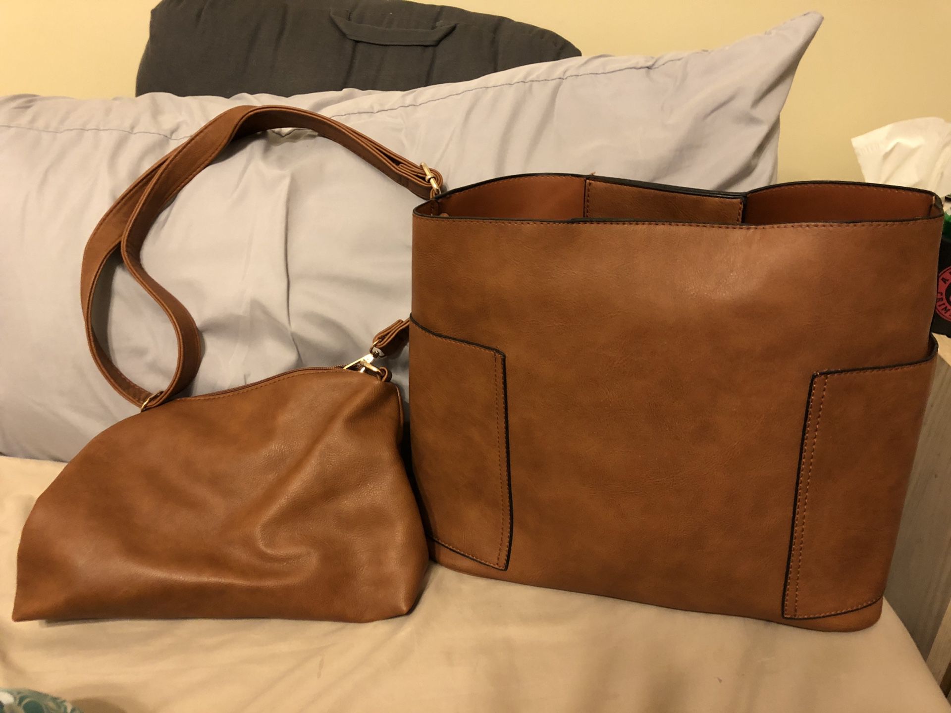Large hand bag brand new. Comes with smaller purse also never used.
