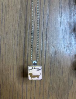 “Good doggy” necklace with pink background & brown wiener dog on silver chain