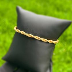 Italy Jewelry 14k solid Yellow Gold twisted shaped bangle 7.00” 5.70 grams 4.30mm