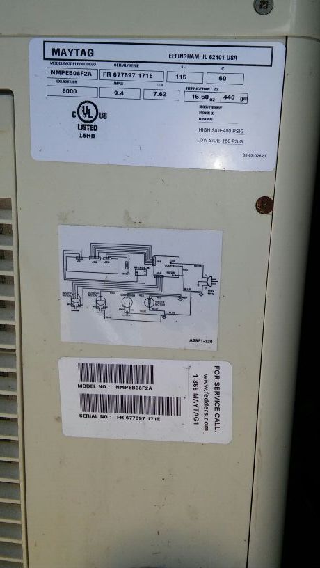 This is a picture of the back details about the air conditioner machine it has the model and serial number on it