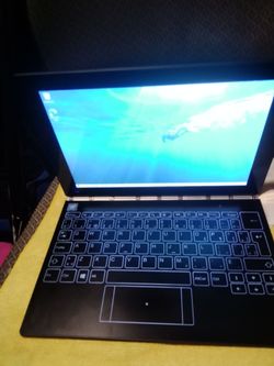 Lenovo Yoga Book YB1-X91F is an ultra-slim 10.1-inch 2-in-1 convertible tablet running Windows 10