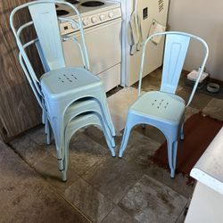 set of 4 light blue metal chairs 