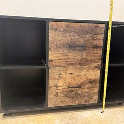 2 drawer file cabinet and cubby space. Wooden file drawer and black cubby drawers