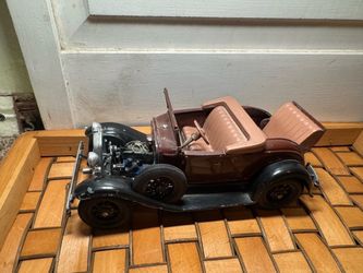 a scale model or collectible die-cast car  vintage convertible model (such as a 1931 Ford Model A Roadster