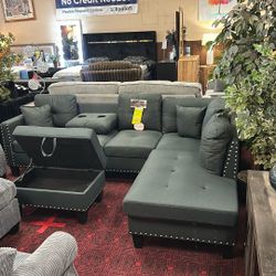 Sectional With Ottoman And Back Pillow With Cup Holders
