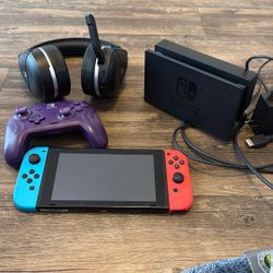 Nintendo Switch 1 with Gaming Accessories (extra controller, headphones, tv stand, and charger)  