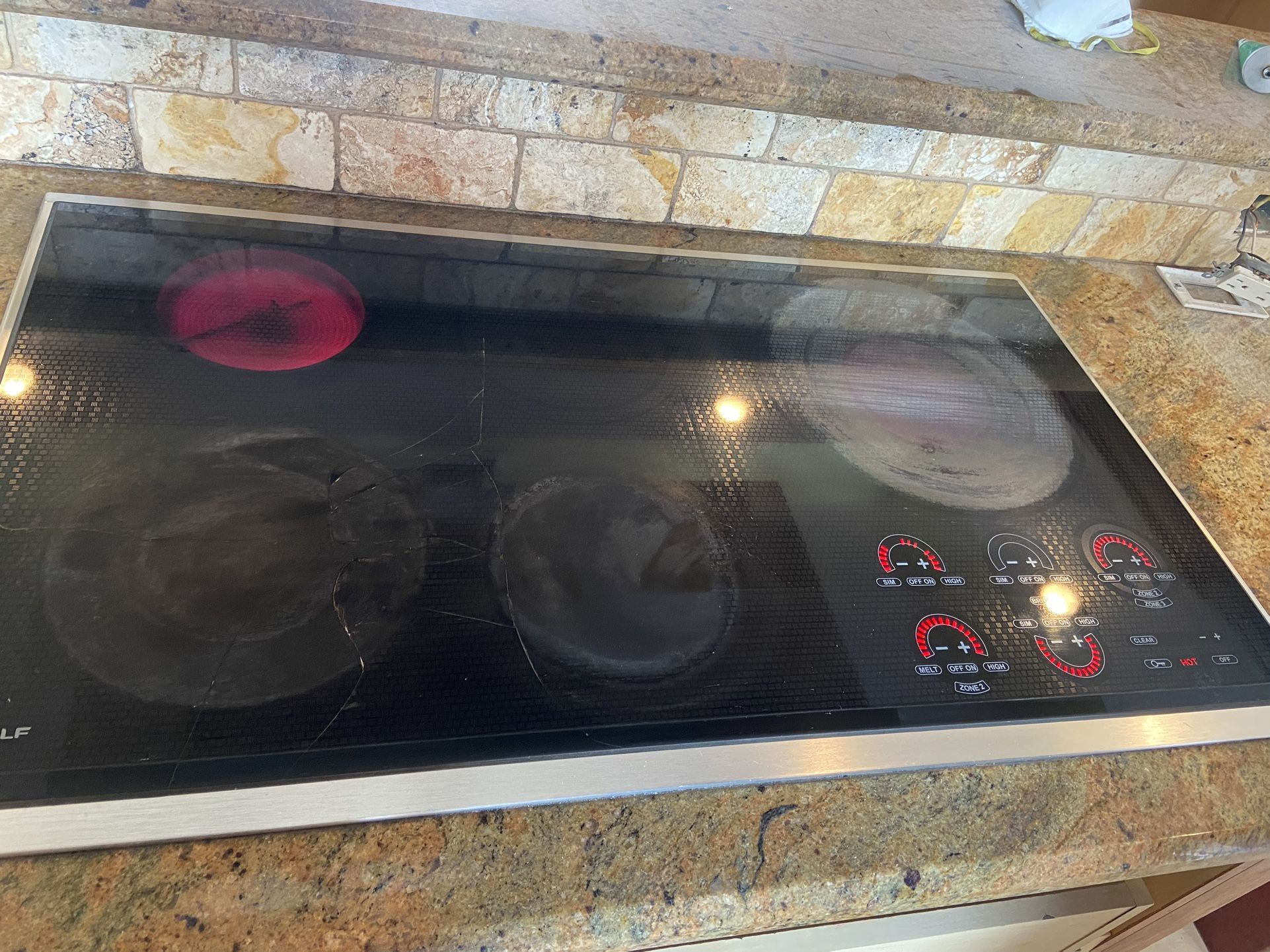 Wolf Electric Stovetop And Double Wall Oven And Sub Zero Fridge