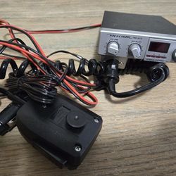 Realistic TRC-415 mobile CB radio with microphone and power cable.
Classic 40-channel CB transceiver