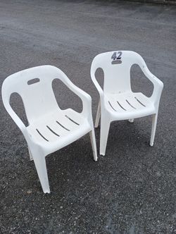2 plastic chairs lawn garden 