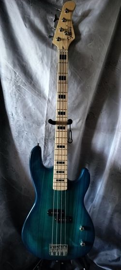 Brand new electric bass with new gig bag cable and shoulder strap