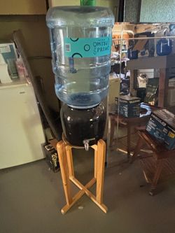 Water dispenser with stand and refill jug