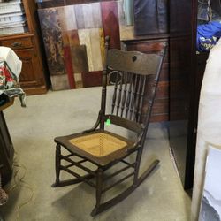 Antique Oak Pressed Back Caned Seat Rocker