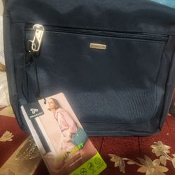 A compact crossbody with a built-in 5-Point Anti-Theft security system to protect your valuables.