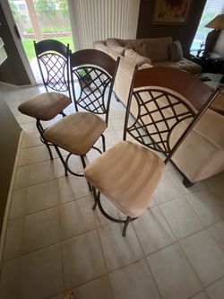 Set of three metal swivel barstools