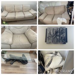 Italian leather couches, painting, table and pillows