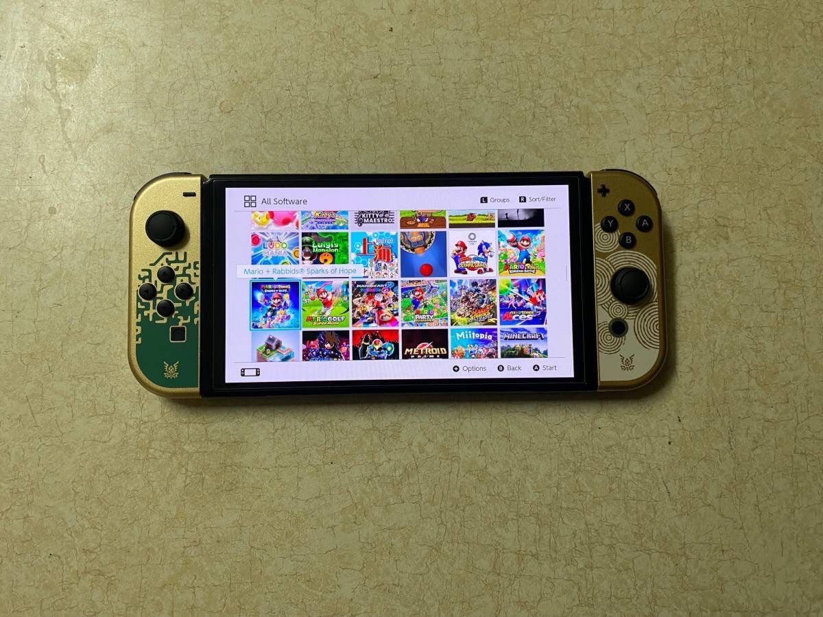 NINTENDO SWITCH OLED with 100 SWITCH GAMES