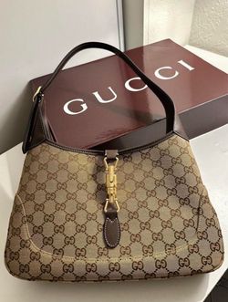 Medium shoulder bag in GG canvas.