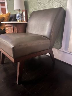 Two brown accent chairs