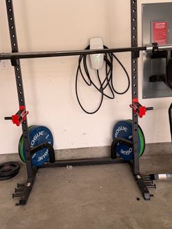 Squat Rack with Barbell and Rogue Weight Plates