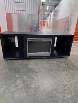 64.76-in W Black Oak TV Stand with Fan-forced Electric Fireplace