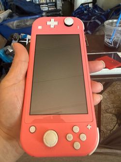 Nintendo Switch Lite Coral with 2 Games