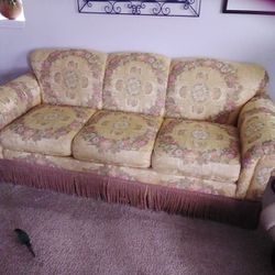 Vintage Sofa.....mostly gold in color with different colors all through out 