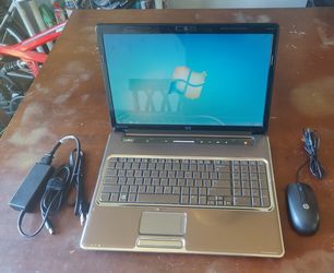 HP Pavilion dv7-1260us Entertainment Notebook Computer with HP mouse.