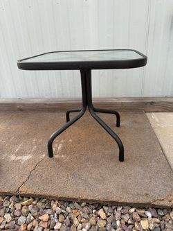 Sturdy metal  N table with glass top