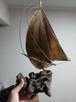 Sailboat art piece decoration on driftwood