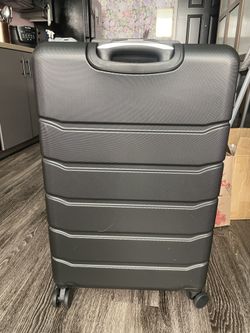 BRAND NEW - 28” BLACK SUITCASE - $50