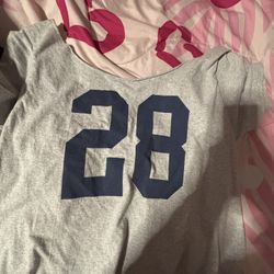 Brandy Melville John Galt Robyn 28 off-the-shoulder top in a gray/cream color with navy numbers