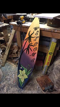 Solid wood hand crafted welcome surfboard
