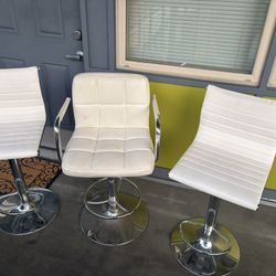 three bar stools. some stains, a little rust. 