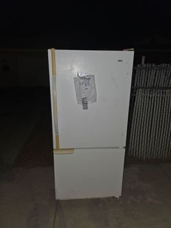 Free refriderator on curb.