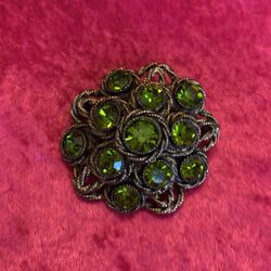 Vintage signed HAR peridot green color faceted rhinestone dome brooch