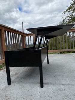 Sleek black table that lifts