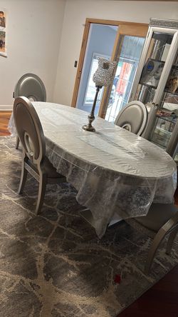 Beautiful silver dining table 8 chairs included Beautiful silver dining table 8 chairs included
