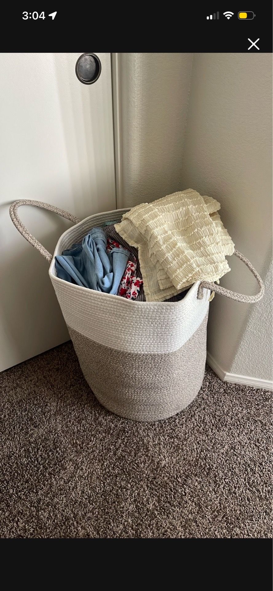 Big basket of womens clothes