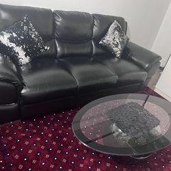 Two Black Leather Couches With Two Glass Modern Tables With Two Cool Carpets