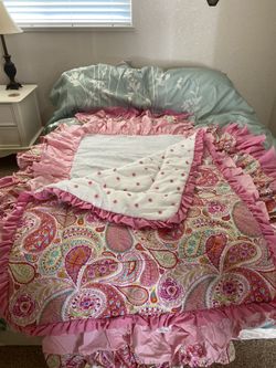 Carousel crib comforter and crib skirt